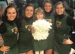 My granddaughter, Aly, proudly pictured with UAB Cheerleaders