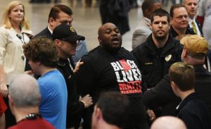 Mercutio Southall Jr., being escorted out of Donald Trump rally in Birmingham